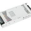 White metal DC power supply module with screw-terminal block on the right, used to provide regulated DC power for electronics projects.