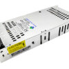 Metal enclosed switching power supply with ventilation slots and a yellow caution label on the side, and a terminal block at the front edge