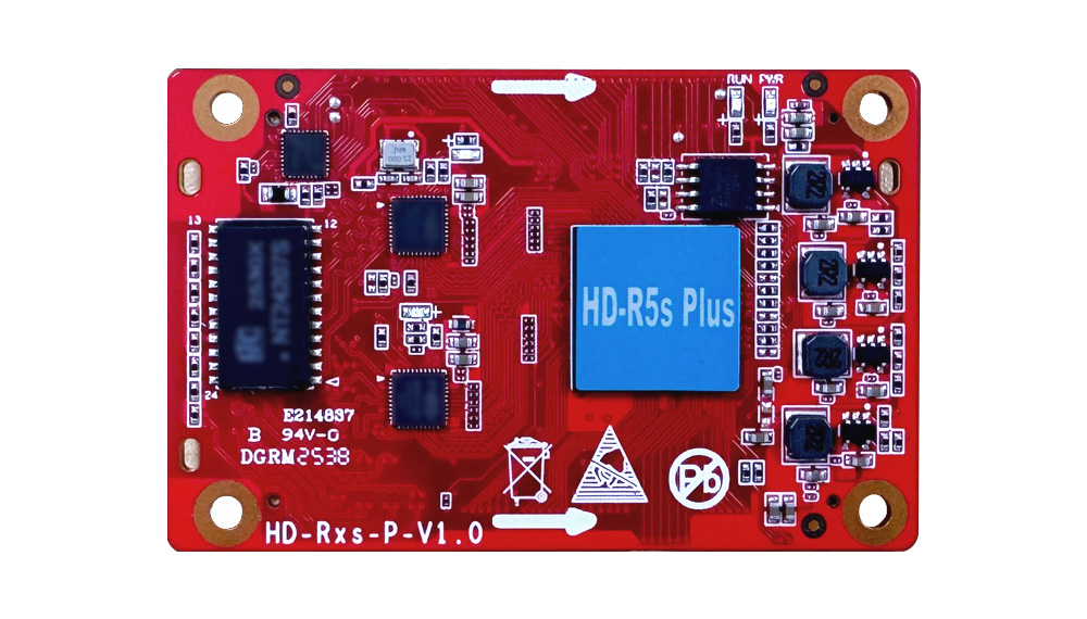 Red printed circuit board featuring a large blue HD-R5s Plus component, multiple chips, and surface-mounted components with mounting holes at corners.