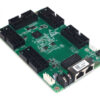 Green I/O expansion circuit board with six large black socket connectors and two Ethernet ports along one edge, used for development or interfacing multiple peripherals.