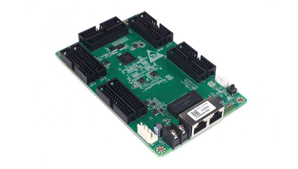 Green I/O expansion circuit board with six large black socket connectors and two Ethernet ports along one edge, used for development or interfacing multiple peripherals.