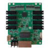 Green PCB expansion board with eight black edge connectors (four on each side), a central processor, and a brown connector at the bottom; various small components scattered across the board.