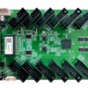 Green PCB development board with two rows of black edge connectors and various chips; appears to be an expansion/prototyping card.