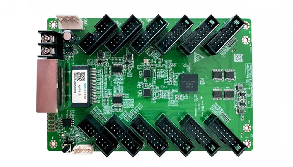Green PCB development board with two rows of black edge connectors and various chips; appears to be an expansion/prototyping card.