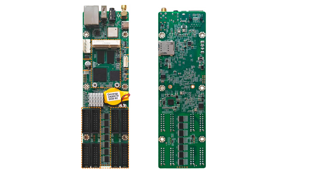 Two green circuit boards laid out vertically; left board has memory chips and a yellow warning/coin cell, right board shows dense circuitry and a USB/port at the top.