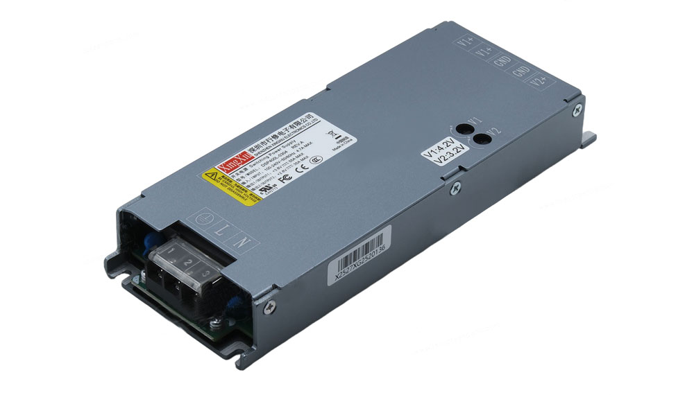 Metal DC power supply module with a front terminal block and mounting flanges on a grey enclosure