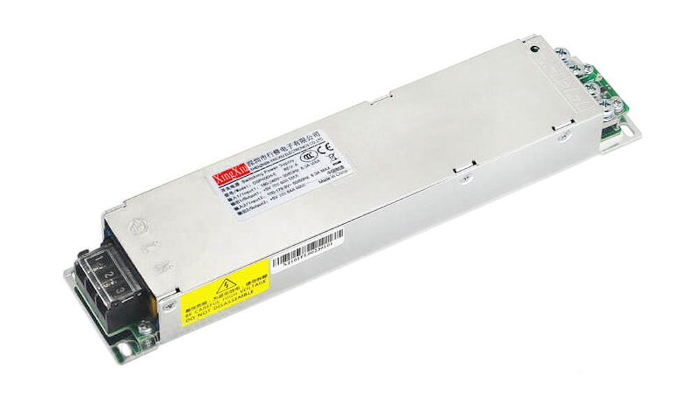 Metal rectangular switching power supply module with input/output terminal blocks at both ends and safety labels on top surface, used to convert AC to DC.