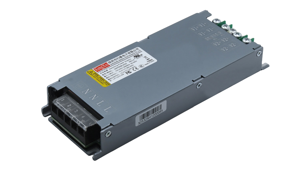 Gray metal DC power supply module with a terminal block on one end, designed for DIN rail installations.